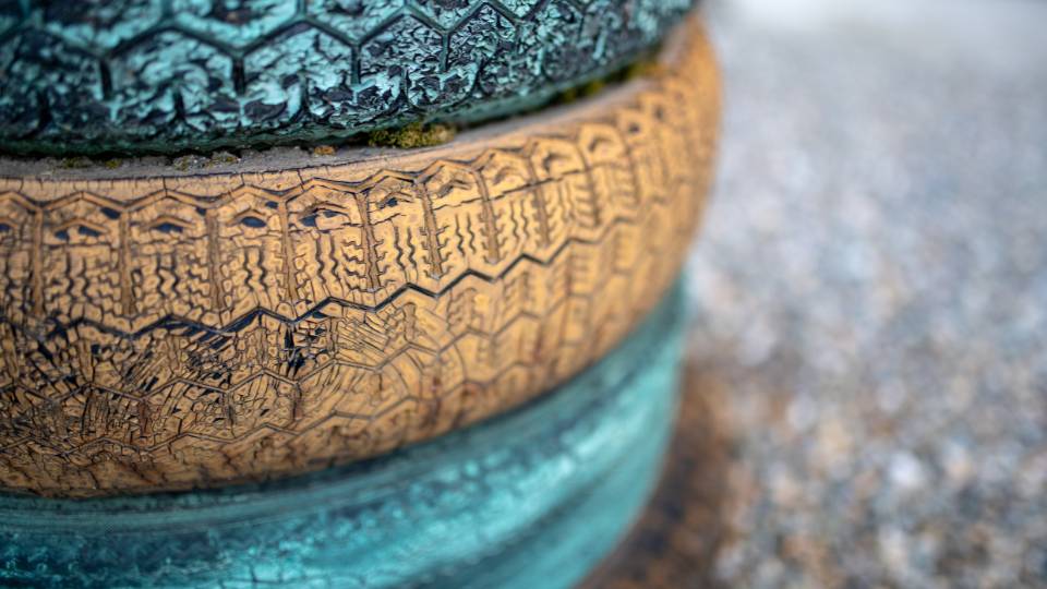 an art sculpture made out of painted tyres 
