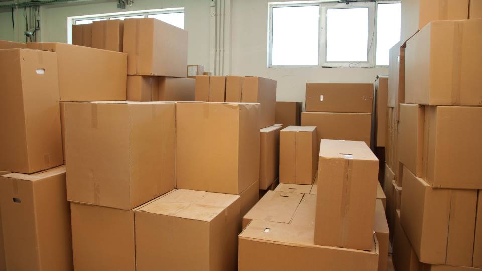 a warehouse full of cardboard waste ready to sell
