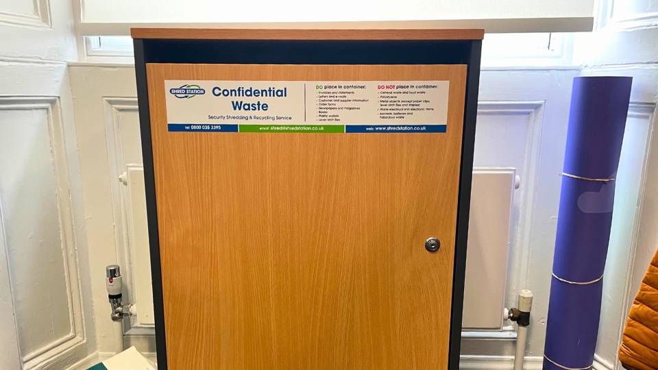 confidential waste bin inside an office