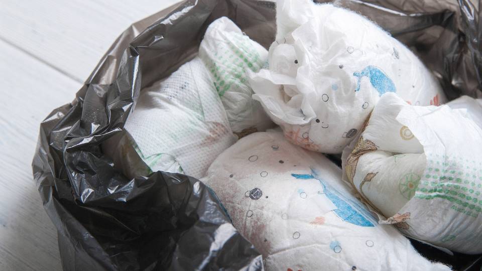 lots of nappies in bin ready to be diposed of