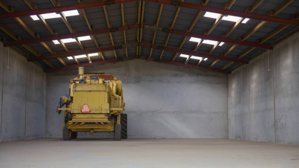 a farm lorry in an empty warehouse on an agricultural farm