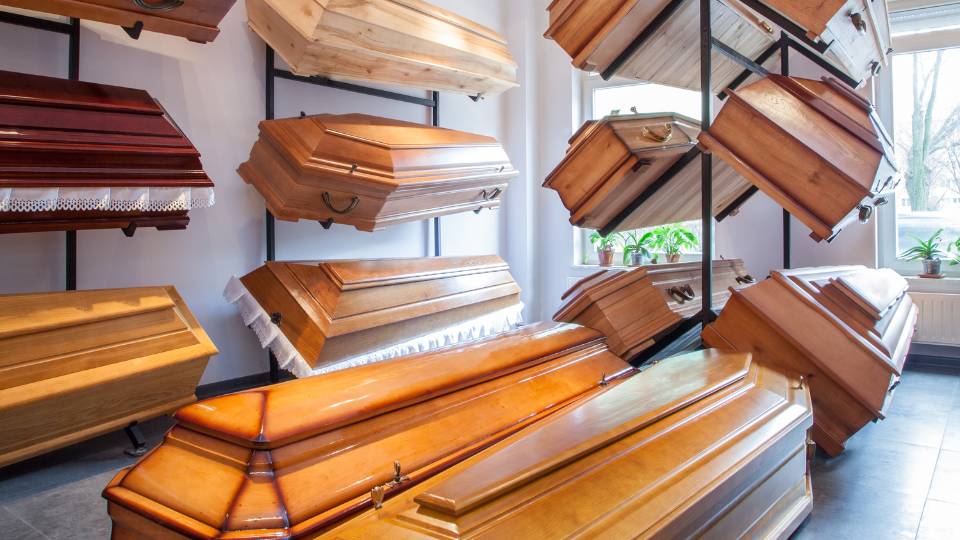 Wooden coffins at a funeral home for sale