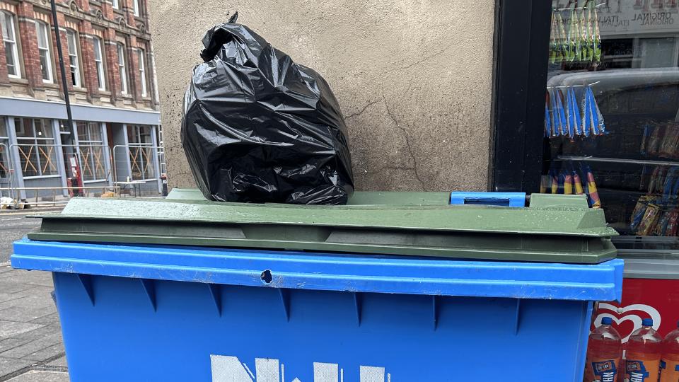 a general waste bin bag on top of a 1100L general waste bin 