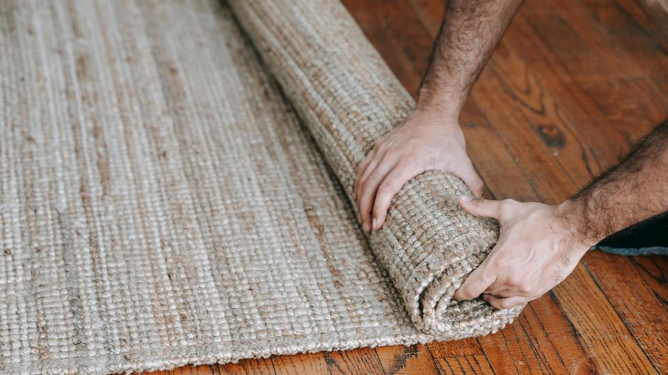 Rolling up a recycled carpet