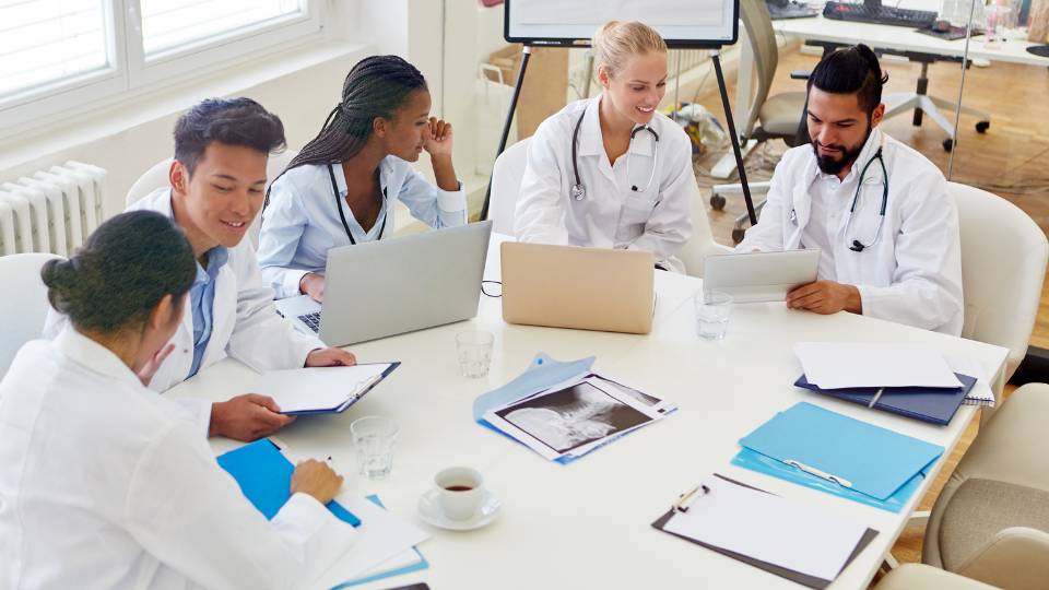 staff in a hospital being educated about recycling and waste