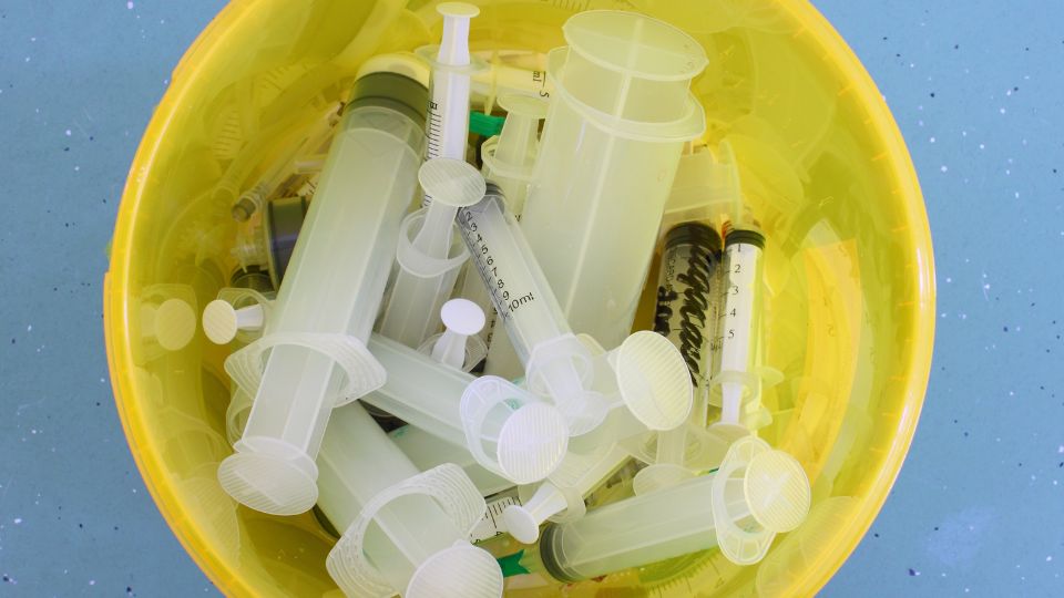 a bin in a hospital full of hospital waste