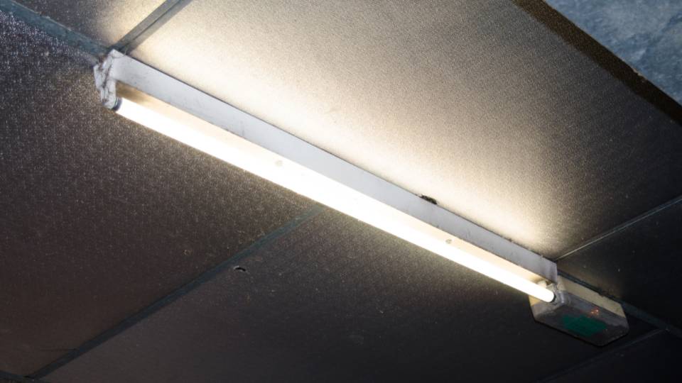 fluorescent light tube in office ceiling