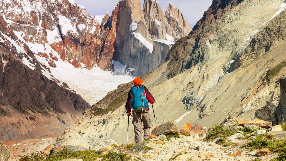 Person climbing Patagonia mountains.