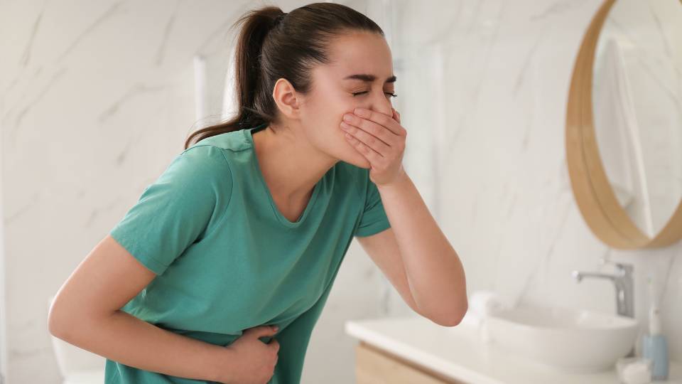 woman vomiting after health risks of pests in the UK 