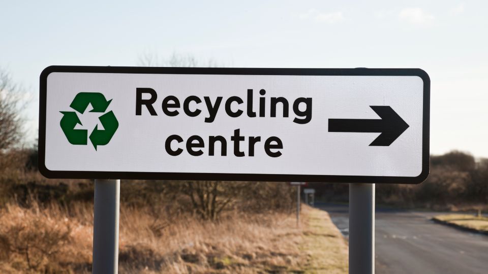 sign to a recycling centre in the UK