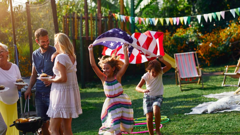 Party for the 4th July celebrations with American flag in garden.