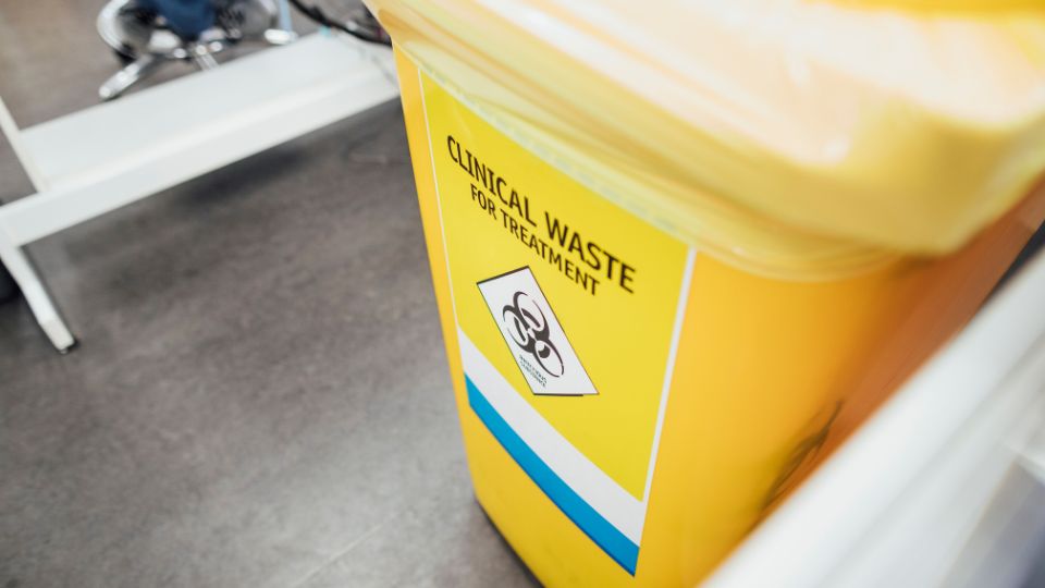 Yellow Clinical waste bin.