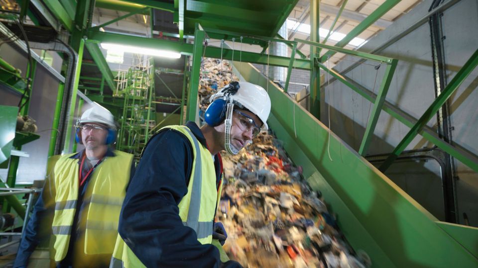 Rubbish shoot being organised by workers.