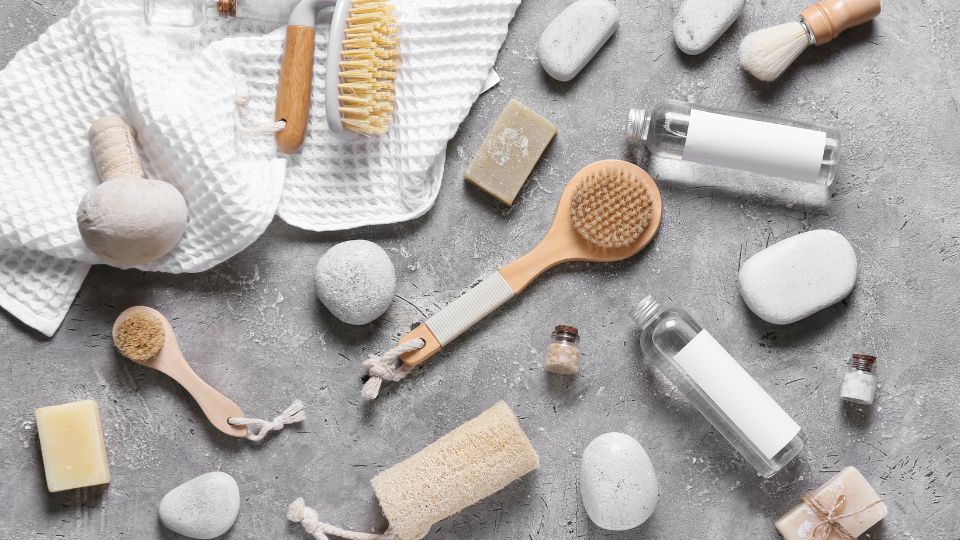 Beauty products scattered on a concrete floor.