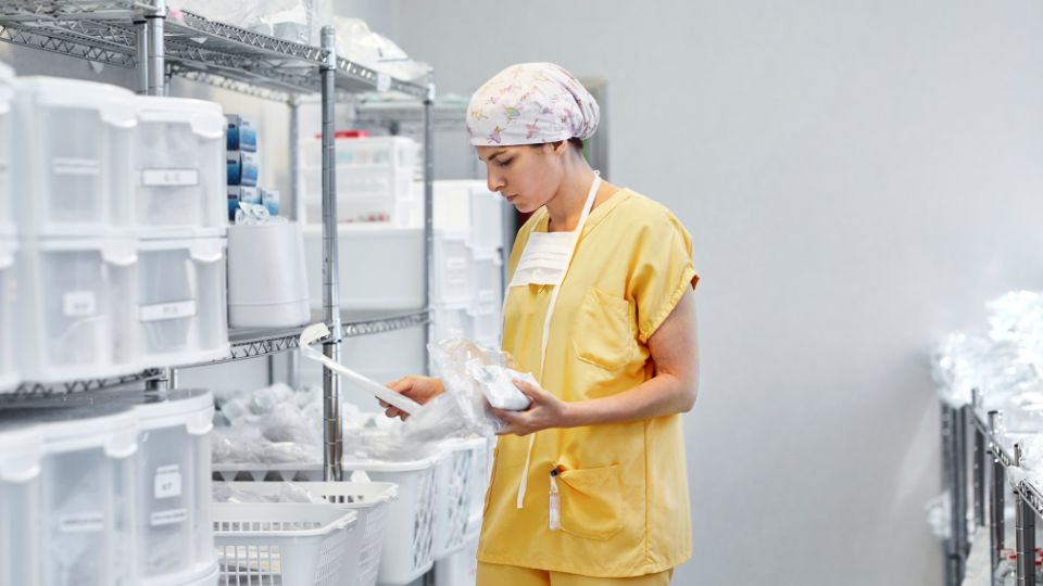 Clinical employee looking at supplies.