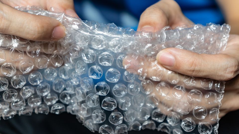 Bubble wrap waste being held.