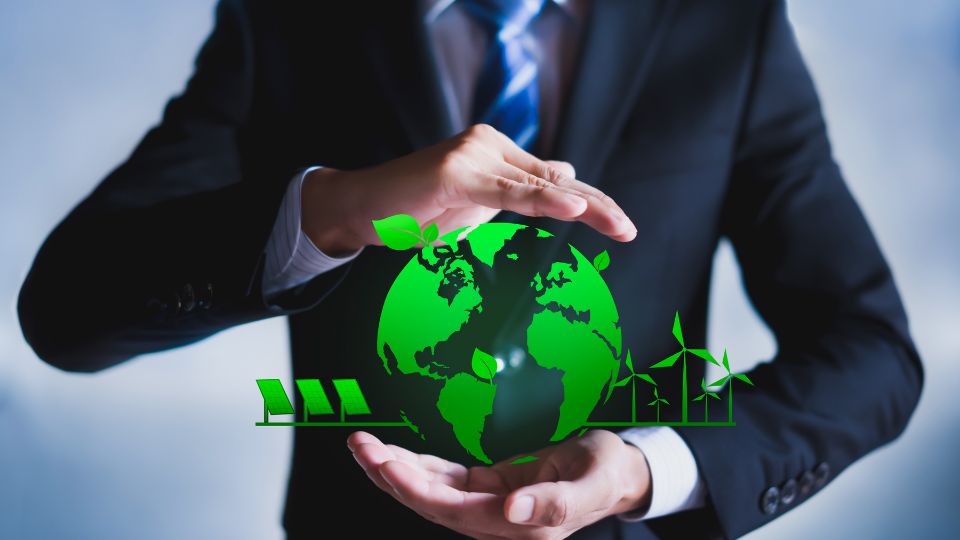 Business owner holding green earth symbol.