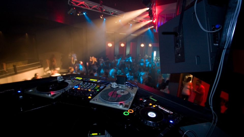 Behind the DJ decks at a nightclub