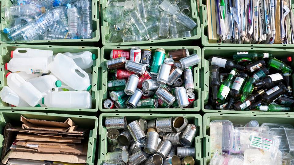 different tubs of recycling in an office