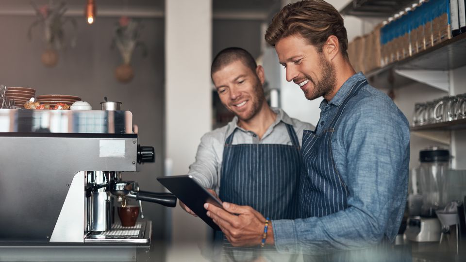 Inventory levels software being used by employees in a cafe.