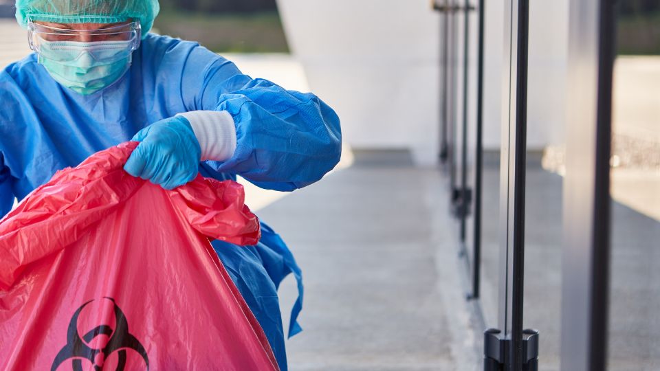 Biohazard waste being disposed.