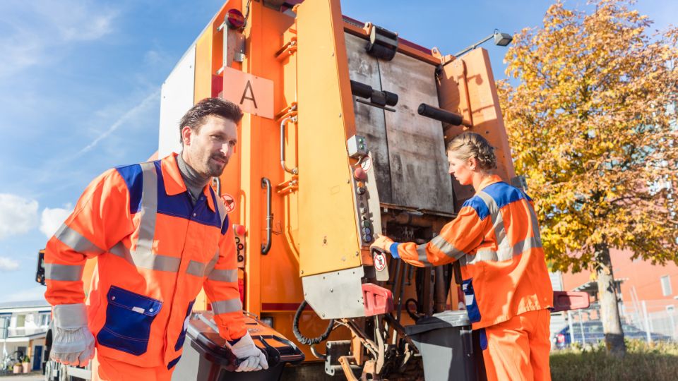 Bin Lorry workers disposing of waste.