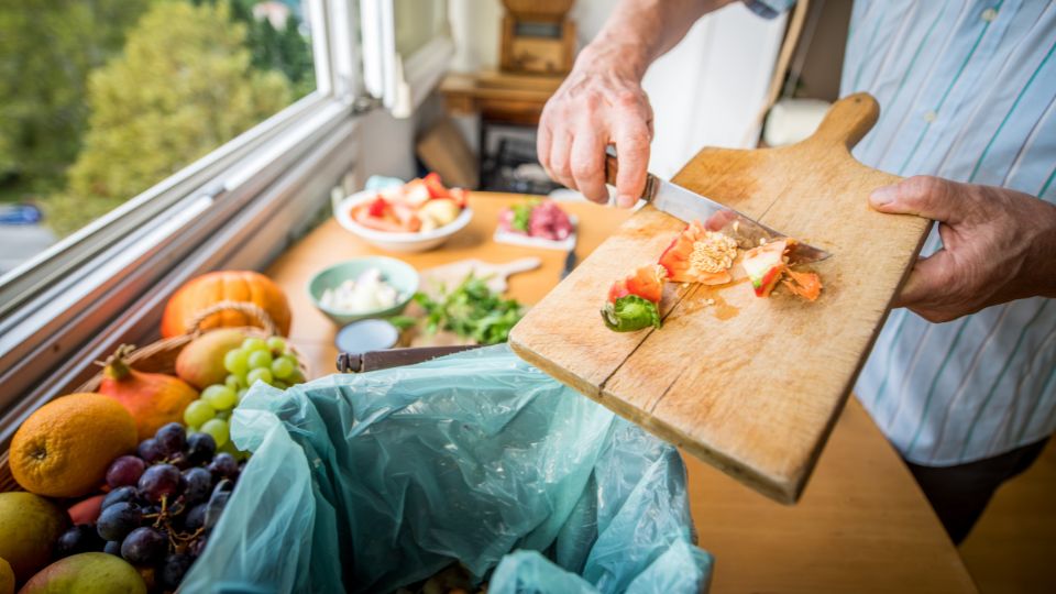 Food waste being disposed of while cooking.